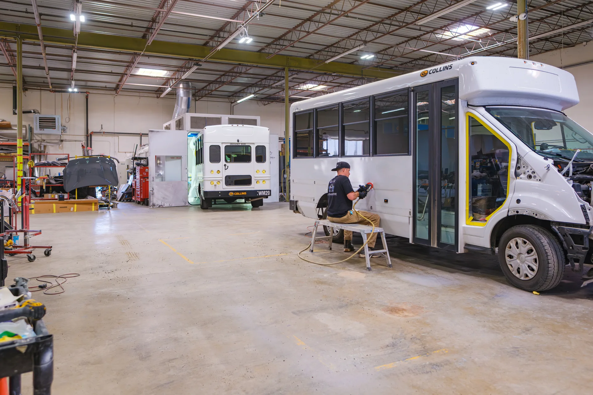 Bus and shuttle van repair in progress